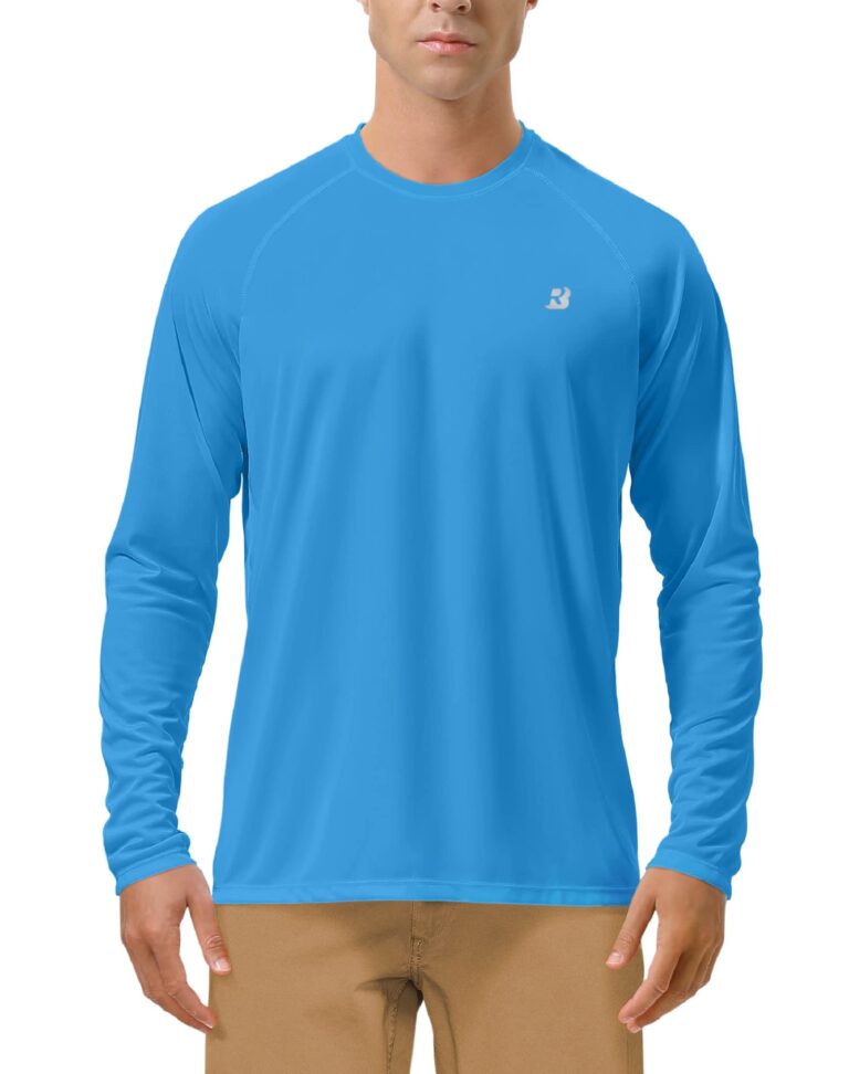 Man wearing a blue long-sleeved shirt with a small logo on the chest