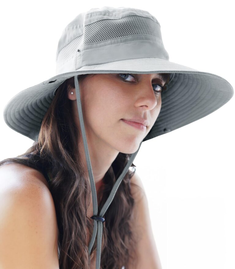 Woman wearing a gray sun hat with a wide brim and chin strap